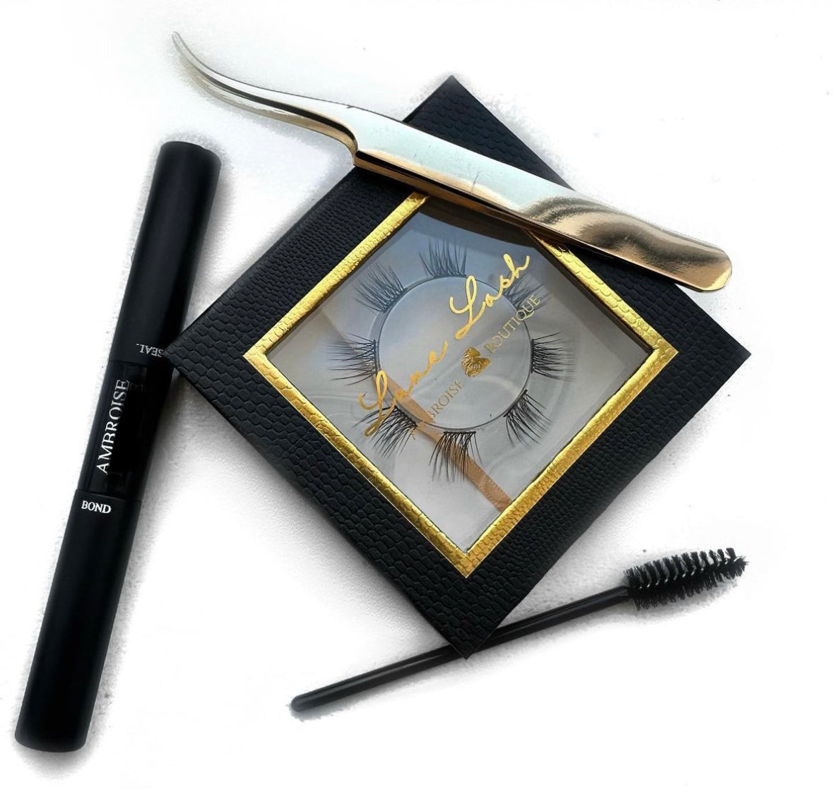 image of lash box, lash glue, lash tweezer and lash spoolie brush